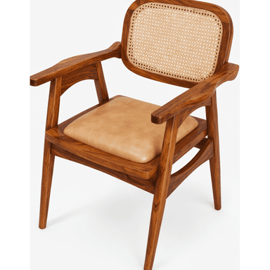 A mid-century style armchair featuring a solid wood frame, a natural cane woven backrest, and a light brown leather-padded seat. The chair has elegantly curved armrests that integrate seamlessly into the structure and stands on four tapered legs. — 3D model (AI enhanced source)