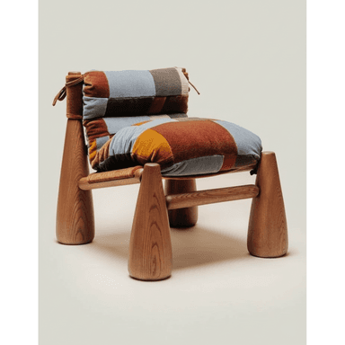 A low-slung lounge chair featuring a sturdy wooden frame with thick, tapered legs and a plush, multi-toned patchwork upholstered cushion secured with fabric ties. — 3D model (AI enhanced source)