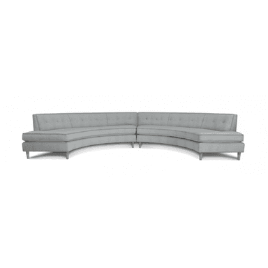 A light grey, two-piece curved sectional sofa featuring a low profile, button-tufted backrests, and light-colored, tapered wooden legs. The design is modern and consists of two sections that form a gentle arc. — 3D model (AI enhanced source)