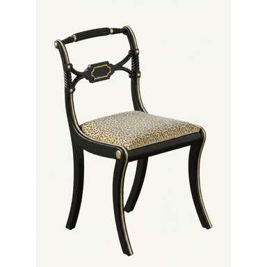 A Regency-style dining chair featuring a black lacquered wooden frame with elegant gilded accents and an upholstered seat covered in a distinctive leopard print fabric. The chair exhibits classic Klismos-inspired curved legs and a decorative backrest. — 3D model (AI enhanced source)