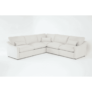A cream-colored modular sectional sofa upholstered in a soft fabric, featuring plush cushions and a low-profile design, arranged in an L-shape. — 3D model (AI enhanced source)