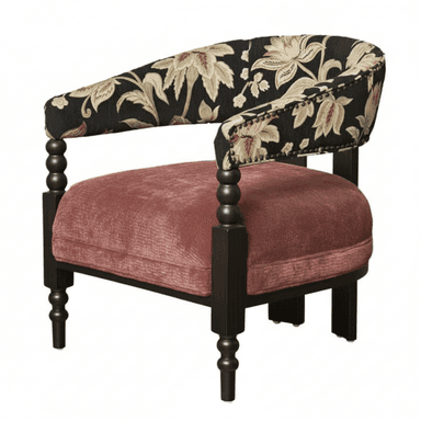 An eclectic barrel back armchair featuring a rounded, continuous back and armrest upholstered in a black fabric with a multi-colored floral jacquard pattern, accented with decorative nailhead trim. The seat cushion is upholstered in a soft, dusty rose velvet. The frame is dark-stained wood, with distinctive turned front legs and simpler square rear legs. — 3D model (AI enhanced source)