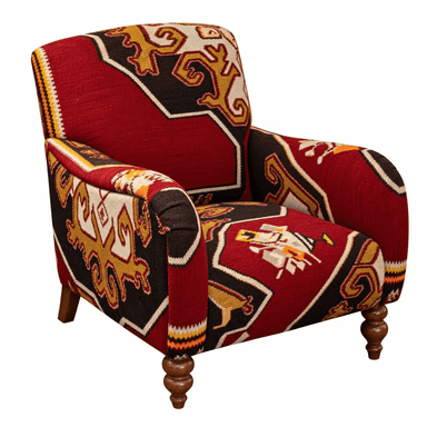 An upholstered armchair featuring a distinctive Kilim-style geometric pattern across its entire surface. The chair has a traditional club chair silhouette with rolled arms and a relatively compact form. It is supported by four wooden legs, with the front two being ornately turned and the rear two appearing more tapered and straight. The fabric displays a vibrant color palette of deep red, black, gold/ochre, and cream, with accents of orange and white, forming intricate interlocking motifs and borders. The upholstery covers all visible parts of the frame, including the back, seat, and arms, creating a cohesive and bold design statement. — 3D model (AI enhanced source)