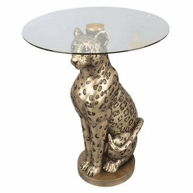 A decorative side or accent table featuring a detailed, seated leopard sculpture as its base, supporting a round, clear glass tabletop. The leopard base is finished in a metallic bronze or brass tone. — 3D model (AI enhanced source)
