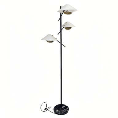 A multi-headed floor lamp with a black metal stem supporting three conical white lampshades. The lampshades are fitted with brass-colored lamp holders and appear to be made of frosted glass or a similar translucent material. The base of the lamp is circular and features a dark marble pattern with white and gold veining. A black power cord is visible near the base. — 3D model (AI enhanced source)