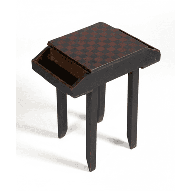A small, rectangular wooden table featuring a hand-painted checkerboard top in black and reddish-brown, with an integrated slide-out storage compartment. The table is finished in distressed black paint and stands on four straight, square-profile legs. — 3D model (AI enhanced source)