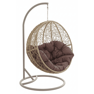 A contemporary egg-shaped hanging chair featuring a beige woven rattan basket suspended from a freestanding grey metal C-shaped stand. The chair includes a plush, tufted brown cushion for comfort. The stand has a circular base for stability. The chair's design suggests use in indoor or outdoor relaxed settings. — 3D model (AI enhanced source)