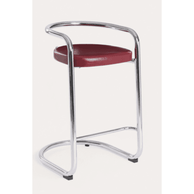 A modernist bar stool featuring a continuous chrome-plated tubular steel frame that forms the legs, footrest, and a curved backrest/armrest. It has a round seat upholstered in deep red material, resting on a stable cantilever-style base with black protective feet. — 3D model (AI enhanced source)