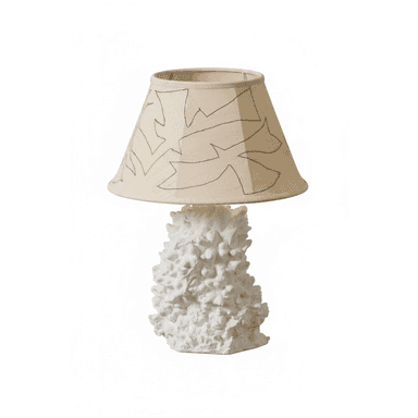 A contemporary table lamp featuring a sculptural, highly textured white ceramic or plaster base that resembles organic forms like coral or abstract rock formations. It is topped with a conical fabric lampshade in a neutral beige or cream color, adorned with a black outline illustration depicting abstract leaves or organic shapes. The overall design emphasizes natural textures and artistic detailing. — 3D model (AI enhanced source)