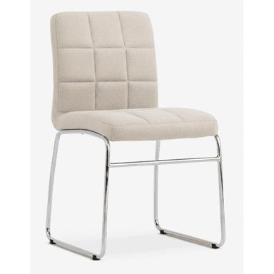 A modern upholstered dining side chair featuring a sled base frame. The seat and backrest are upholstered in a light beige, textured fabric, with the backrest exhibiting a square tufted or quilted pattern. The frame is constructed from polished chrome or stainless steel tubing, forming a continuous sled base that provides stability and a minimalist aesthetic. The chair appears to be designed for comfort and contemporary environments. — 3D model (AI enhanced source)