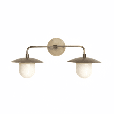 A contemporary double wall sconce featuring an aged brass finish and two opal glass diffusers. It has a circular wall mount from which extends a horizontal arm, supporting two downward-facing lights. Each light has a shallow, dome-shaped metal shade covering a capsule-shaped opal glass diffuser. — 3D model (AI enhanced source)