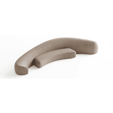 A modular, curved sofa with a rounded, organic form. It consists of two sections that form a gentle arc, with one section appearing lower and more akin to a bench or ottoman. The upholstery has a soft, matte texture. The overall design is modern and minimalist. — 3D model (AI enhanced source)