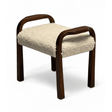 A compact, backless stool featuring a dark brown bentwood frame that gracefully forms both the legs and integrated armrests. The seat is upholstered in a plush, cream-colored sherpa fabric, offering a soft texture contrast to the smooth wood. Its design suggests a blend of functional seating and a decorative accent. — 3D model (AI enhanced source)