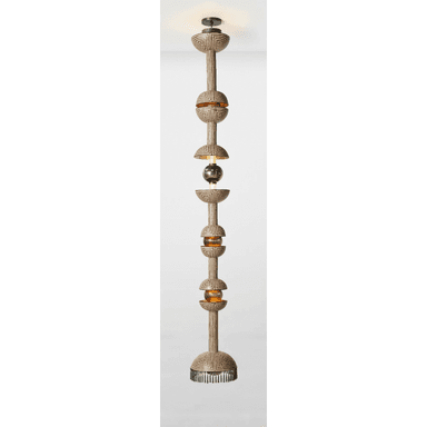 A very tall, multi-tiered pendant light featuring an elongated, segmented design. The main body is decorated with a black and off-white geometric pattern, possibly tribal or Art Deco inspired. It incorporates several spherical and semi-spherical glass elements, some in a warm amber tone, and a darker, possibly smoked glass sphere in the middle. The fixture hangs from a dark ceiling rose and ends with a fringe-like detail at the bottom. — 3D model (AI enhanced source)