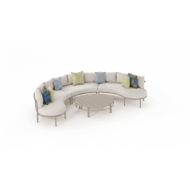 A contemporary outdoor furniture set comprising a large, curved modular sectional sofa and a matching round coffee table. The sofa features a light beige aluminum frame, plush light-colored cushions, and several accent pillows in blue, green, and patterned fabrics. The coffee table has a slatted top designed to complement the sofa's frame. — 3D model (AI enhanced source)