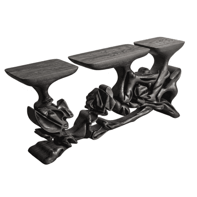 A highly sculptural console table featuring a dark, almost black, wood finish. It comprises three distinct, irregularly shaped flat display surfaces supported by an intricate, organically formed base that evokes draped fabric or fluid natural structures. The wood grain is visible through the dark finish, adding texture to its complex form. — 3D model (AI enhanced source)