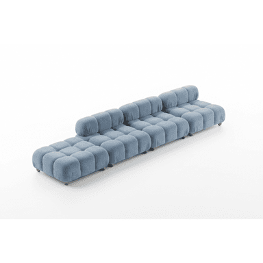 A modular sofa with a low profile and rounded, tufted cushions. The sofa is upholstered in a textured blue fabric and features a linear configuration with multiple sections, including a chaise lounge element on the left. Small wooden legs are visible supporting the structure. — 3D model (AI enhanced source)