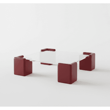 A modern coffee table featuring a clear glass top supported by four distinct, cube-like legs finished in a deep red matte lacquer. The legs have rounded corners and a substantial, blocky appearance, creating a strong visual contrast with the delicate glass surface. — 3D model (AI enhanced source)