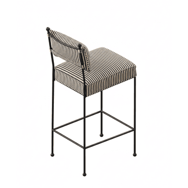 A contemporary bar stool featuring a slender black metal frame and striped upholstered seat and backrest. The design includes an integrated footrest and ball-tipped feet. — 3D model (AI enhanced source)