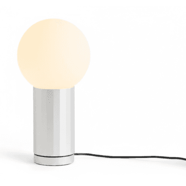 A modern table lamp featuring a spherical, frosted glass diffuser atop a cylindrical base with vertical fluting. The base is light-colored, possibly silver or white, and a black power cord extends from its bottom. The lamp is illuminated, emitting a soft, diffuse light. — 3D model (AI enhanced source)