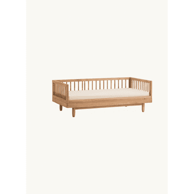 A minimalist daybed constructed from light-toned wood, featuring slatted sides on three edges and supported by four tapered, round legs. It includes a light-colored, upholstered mattress, suggesting a contemporary or Scandinavian aesthetic. The design is clean and uncluttered, suitable for various interior styles. — 3D model (AI enhanced source)