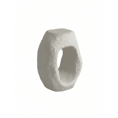 A stool with an abstract, sculptural form. It features a solid, roughly shaped body with a large, irregular opening in the center, suggesting it is designed to be sat upon or used as a small side table. The surface texture is uneven, indicating a material that has been molded or layered. — 3D model (AI enhanced source)