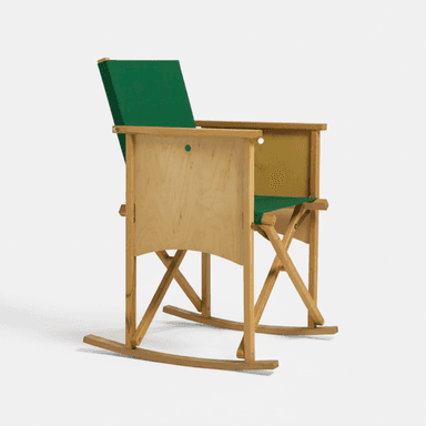 A rocking chair with a light-toned wooden frame, distinct plywood side panels, and a green fabric seat and backrest. — 3D model (AI enhanced source)
