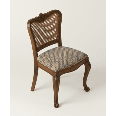 A traditional dining chair with a dark wood frame, featuring a woven cane backrest and an upholstered seat with a geometric pattern. The chair exhibits ornate carvings on its curved back, apron, and cabriole legs, which terminate in stylized claw feet. — 3D model (AI enhanced source)