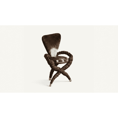 A unique and sculptural accent chair featuring an X-shaped base and armrests crafted from what appears to be dark, twisted wood or resin, giving a rope-like texture. The seat and backrest are upholstered in genuine cowhide, displaying a natural pattern of dark brown and white. The four legs of the base are each tipped with polished brass caps, adding a touch of elegance to its rustic yet modern design. — 3D model (AI enhanced source)