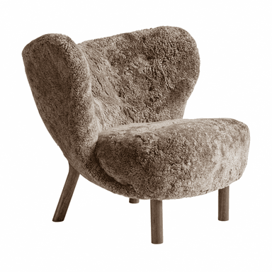 A contemporary lounge chair featuring a plush, rounded form upholstered in a thick, shaggy taupe-colored sheepskin or faux sheepskin material. The chair has an enveloping, cocoon-like backrest that curves around to form the armrests, and a soft, deep seat. It is supported by four wooden legs: two straight, cylindrical legs at the front and two thicker, angled legs at the rear, all with a natural wood finish. — 3D model (AI enhanced source)