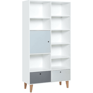 A modern white modular bookshelf featuring an asymmetrical layout of open shelving, a closed cabinet with a light blue-grey door, and two bottom drawers in dark grey and light grey. The unit stands on four splayed wooden legs. — 3D model (AI enhanced source)