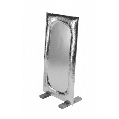A tall, free-standing mirror with an oval reflective surface. The frame surrounding the mirror is irregular and appears to be made of hammered metal, giving it a textured, artisanal look. The mirror is supported by two rectangular grey bases. — 3D model (AI enhanced source)