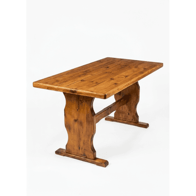A wooden dining table with a rectangular, plank-style tabletop and two trestle-style legs connected by a central stretcher. The wood has a visible grain and knot pattern, finished with a warm, medium-brown stain. — 3D model (AI enhanced source)