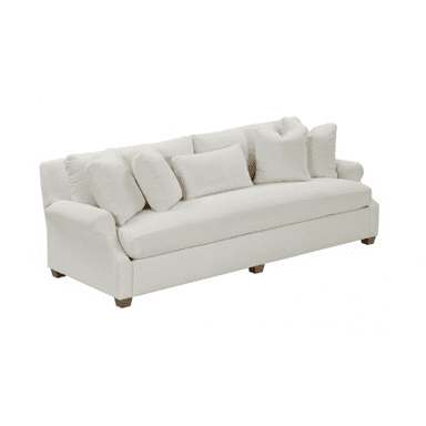 A contemporary sofa featuring a clean, off-white fabric upholstery, rolled arms, and multiple loose back cushions. The sofa sits on short, exposed wooden block feet. It includes several accent pillows, suggesting a comfortable and relaxed aesthetic. — 3D model (AI enhanced source)