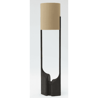 A tall, contemporary floor lamp featuring a sculptural dark-stained wooden base with an organic, carved form, supporting a slender dark-toned vertical stem that holds a cylindrical beige fabric lampshade. — 3D model (AI enhanced source)