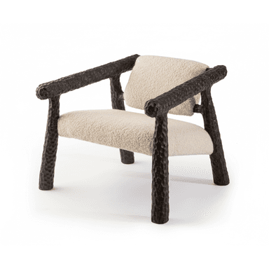 A contemporary lounge chair featuring a distinctive dark, heavily textured frame that resembles hand-hewn wood or rough cast metal, paired with soft, cream-colored boucle upholstery on the seat and backrest. The design emphasizes chunky, rounded forms and a low profile for relaxed seating. — 3D model (AI enhanced source)