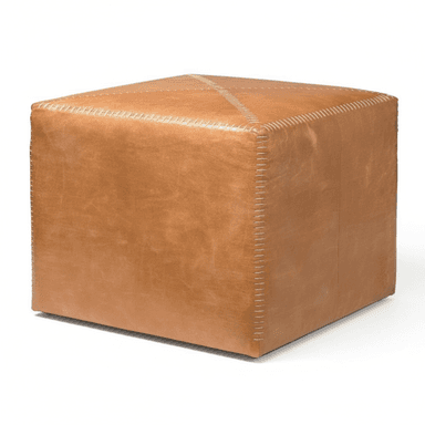 A cube-shaped ottoman upholstered in tan leather, featuring prominent light-colored exposed cross-stitching on all edges and an 'X' pattern across the top surface, suggesting a handcrafted aesthetic. — 3D model (AI enhanced source)