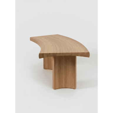 A modern curved bench crafted from light-toned solid oak wood. The design features a gently bowed top surface supported by two thick, substantial legs that are seamlessly integrated and follow the curvature of the top, creating a cohesive, sculptural form. The wood displays a natural grain, emphasizing its organic aesthetic. — 3D model (AI enhanced source)