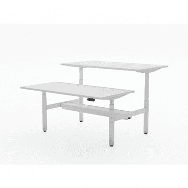 A modern, two-tiered electric standing desk, depicted in a minimalist white studio setting. It features two rectangular white tabletops at different heights, supported by a system of white metal legs and crossbars that are height-adjustable. The design is sleek and contemporary, likely indicating a motorized adjustment mechanism for ergonomic use. — 3D model (AI enhanced source)
