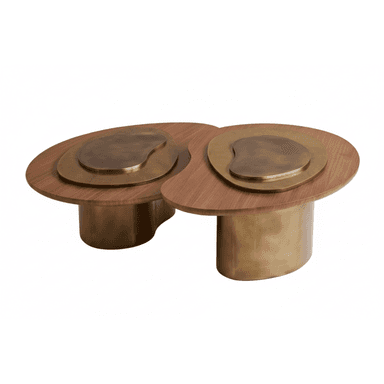 A contemporary coffee table featuring a biomorphic design with a dark wooden top and antique brass-toned metal elements. The tabletop consists of two conjoined organic shapes, each with nested brass-toned inlays. The table is supported by two substantial, organically shaped brass-toned cylindrical bases. — 3D model (AI enhanced source)