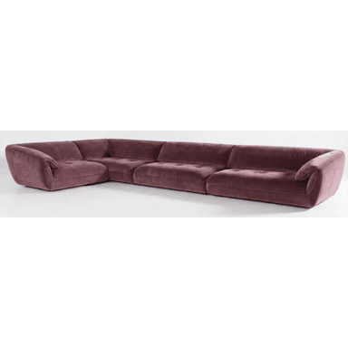 An L-shaped modular sectional sofa upholstered in a plush, mauve-colored velvet fabric. The sofa features a low-profile design with subtly rounded edges and a hidden base, giving it a substantial yet integrated appearance. It is composed of multiple individual modules, including a corner piece and several straight segments, creating a continuous seating arrangement. The seat cushions exhibit a gentle button tufting, contributing to its luxurious and contemporary aesthetic. The overall impression is one of comfort and modern elegance. — 3D model (AI enhanced source)