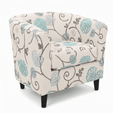 An upholstered barrel armchair featuring a cream-colored fabric with a distinctive floral and scroll pattern in teal and grey. The chair has a rounded back and integrated arms, with a separate seat cushion. It is supported by four short, tapered black legs. — 3D model (AI enhanced source)