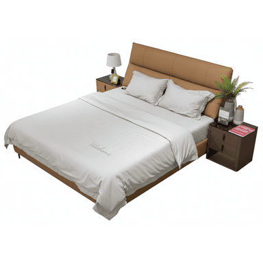 A modern queen-size bed with a tan upholstered headboard and frame, featuring two white pillows and white bedding. The bed is flanked by two matching brown nightstands with black glass tops, one of which holds a lamp, a decorative plant in a vase, and a book. The other nightstand is visible but less detailed. — 3D model (AI enhanced source)
