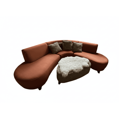 A terracotta-colored, multi-piece curved modular sectional sofa is depicted, designed with a fluid, organic form. The sofa features plush, upholstered seating and backrests, forming a crescent or serpentine shape suitable for a large living space. It is accompanied by a separate, upholstered ottoman with a patterned fabric, which has a shaggy white faux fur throw draped over it. The sofa and ottoman are both supported by small, dark, possibly tapered feet, elevating them slightly from the floor. Several decorative pillows are placed on the sofa, featuring a patterned fabric similar to the ottoman. — 3D model (AI enhanced source)