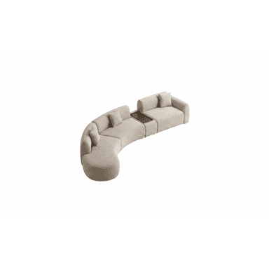 A large, contemporary modular sectional sofa featuring a curved design, upholstered in a light beige fabric, with an integrated dark wood console table segment. It includes several throw cushions for back support. — 3D model (AI enhanced source)
