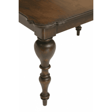 A close-up view of a traditional dark wood table, likely a dining table, showcasing its ornate turned leg and the scalloped profile of the tabletop. The wood has a visible grain and a deep brown finish. — 3D model (AI enhanced source)