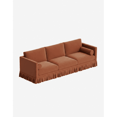 A long, three-seater sofa upholstered in a warm, burnt orange velvet fabric. It features a full, pleated skirt that conceals the base and legs, giving it a traditional yet soft aesthetic. The sofa has three individual seat cushions and three corresponding back cushions. Cylindrical bolster pillows are integrated into or placed on the squared-off arms. — 3D model (AI enhanced source)