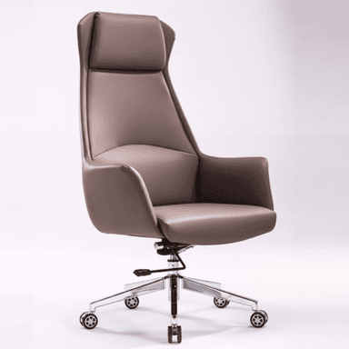 A modern high-back executive office chair upholstered in a smooth, light brown or taupe material, likely leather or faux leather. It features a five-star polished chrome base with dual-wheel casters, integrated armrests, and a prominent headrest cushion, suggesting ergonomic design for office use. — 3D model (AI enhanced source)