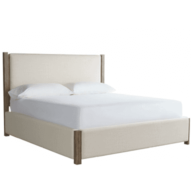 A modern platform bed featuring an upholstered headboard and side rails in a light, neutral fabric, accented by exposed vertical wooden posts at each corner. The bed is shown with a white mattress and pillows, indicating it is designed for a minimalist and contemporary bedroom setting. — 3D model (AI enhanced source)