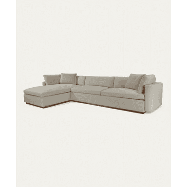 An L-shaped sectional sofa featuring a chaise lounge on one end and a multi-seat configuration. The sofa is upholstered in a light gray or beige fabric and sits on a recessed, dark wooden plinth base. It has a modern, minimalist design with clean lines and includes several loose back cushions and accent pillows. — 3D model (AI enhanced source)